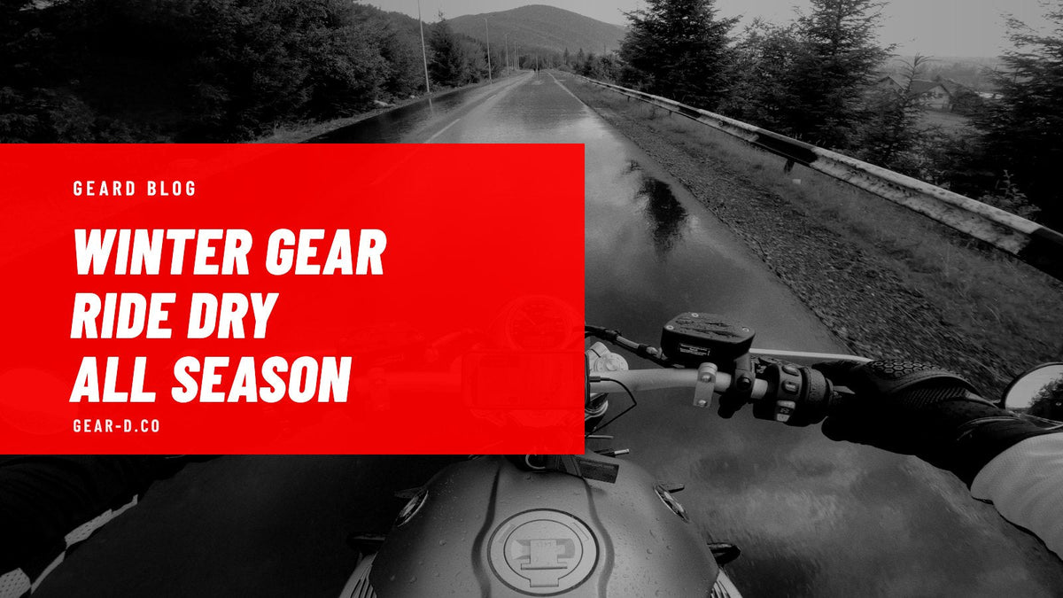 Motorcyclist riding in the rain wearing a waterproof motorcycle jacket and winter gloves